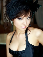 Gorgeous gravure idol can barely keep her tits in her lingerie