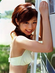 Sultry gravure model seduces with her hot red leather bikini