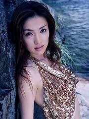 Beautiful asian nymph exhibits her pale ivory skin in a bikini