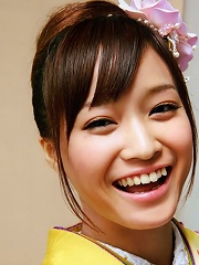 Beautiful gravure idol dressed in a bright and colorful kimono