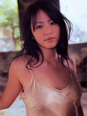 Flirtatious asian idol with large melons spilling from her bikini