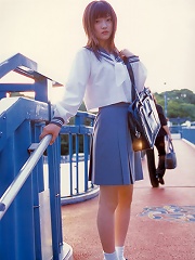 Adorable gravure school girl with pink deliciously kissable lips