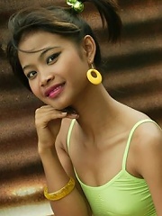 18 year old Thai teen in pigtails has a little fun outide