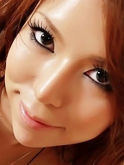 Rino Asuka Asian rubs cock between her boobies and with her feet