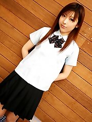 Naughty Asian slut shyly shows off her white panties as she lifts her mini skirt