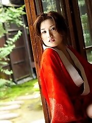 Japanese tramp with an open red kimono waiting for her next fucking appointment