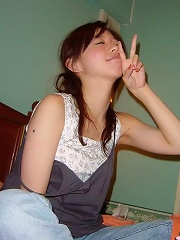 This horny asian coed plays with a toy and then with a boytoy