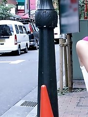 Japanese cutie enjoys modeling and showing off her tight ass and smiling